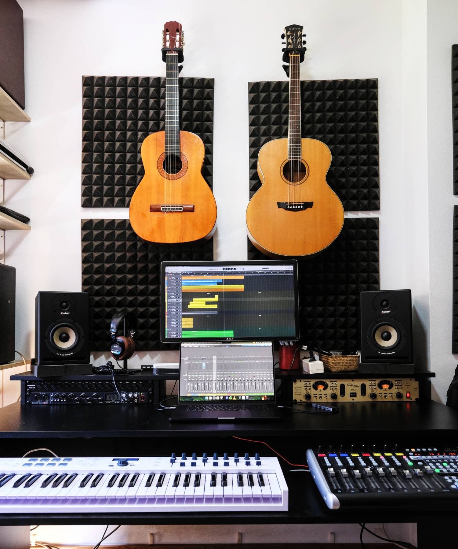 Studio with guitars, DAW and monitors
